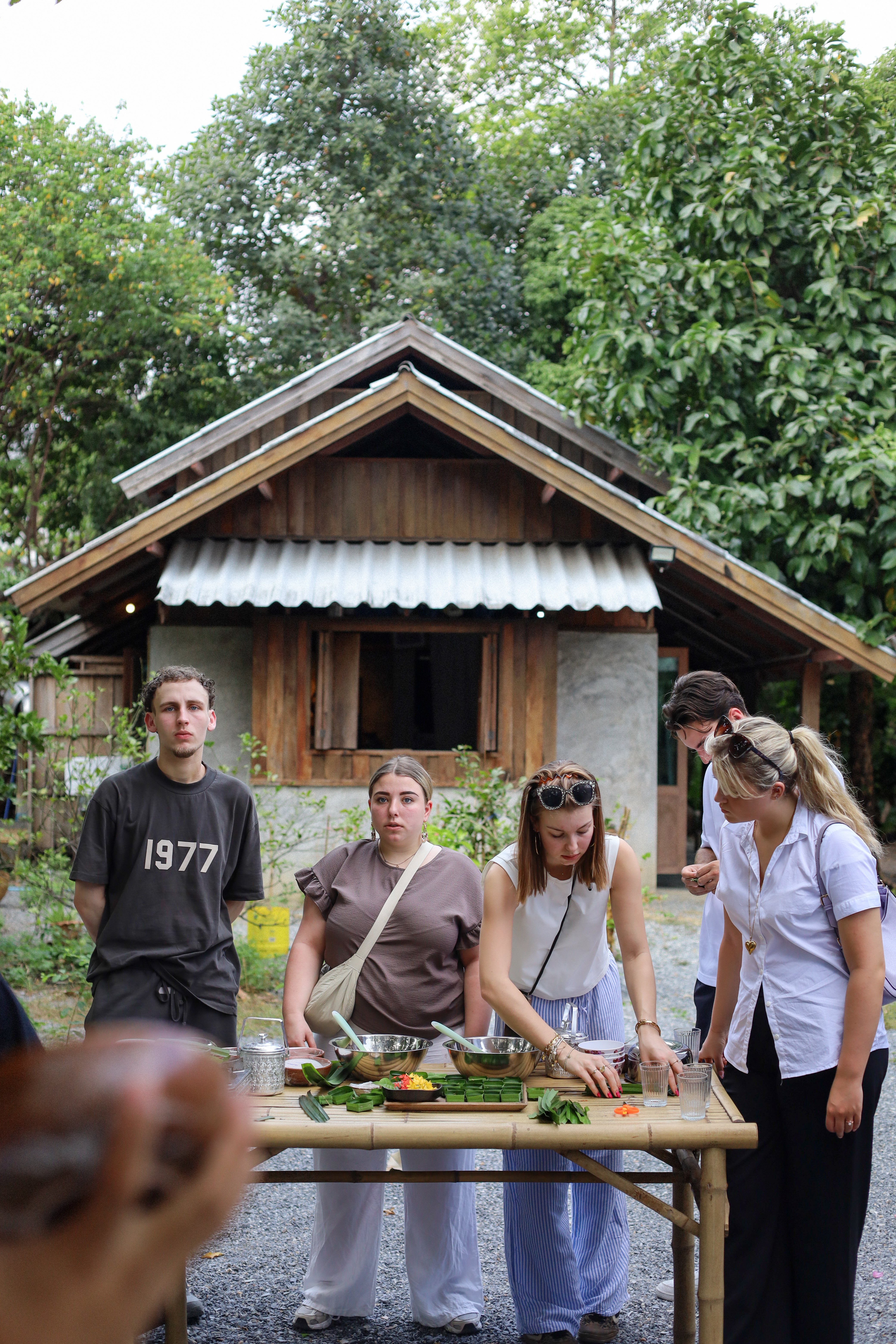 A host presenting bowls of natural dye and finished look choup desserts.
