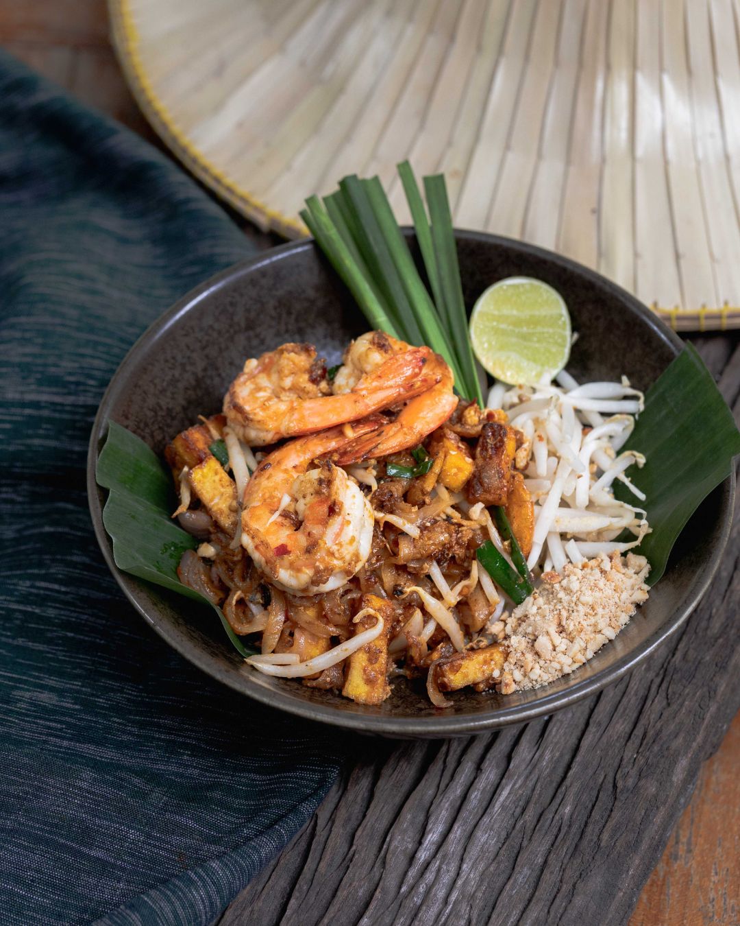 A bowl of Pad Thai with grilled prawns, bean sprouts, and crushed peanuts at Natura Caf&eacute;.