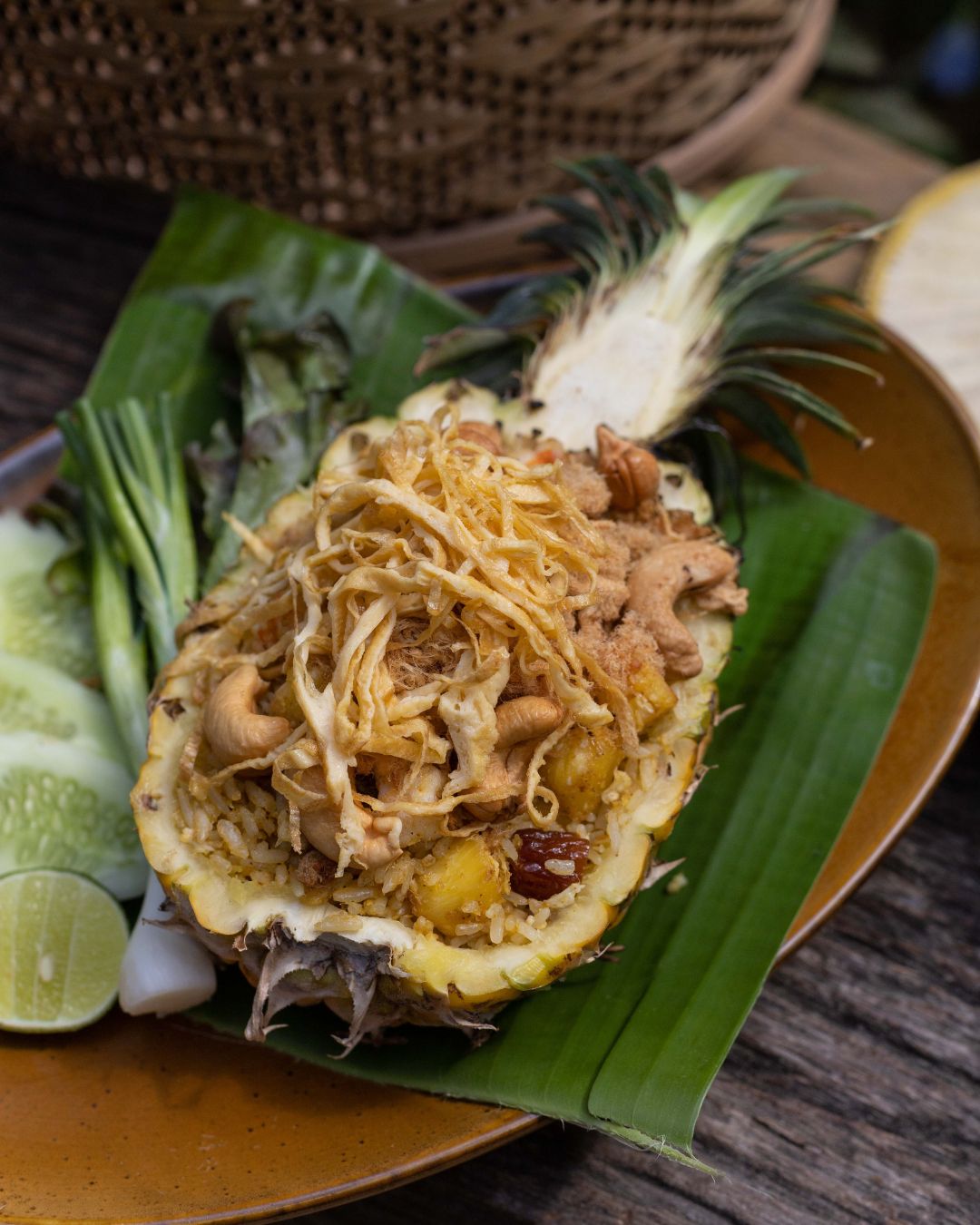 Pineapple fried rice topped with crispy shallots and cashews, served in a hollowed pineapple at Natura Caf&eacute;.
